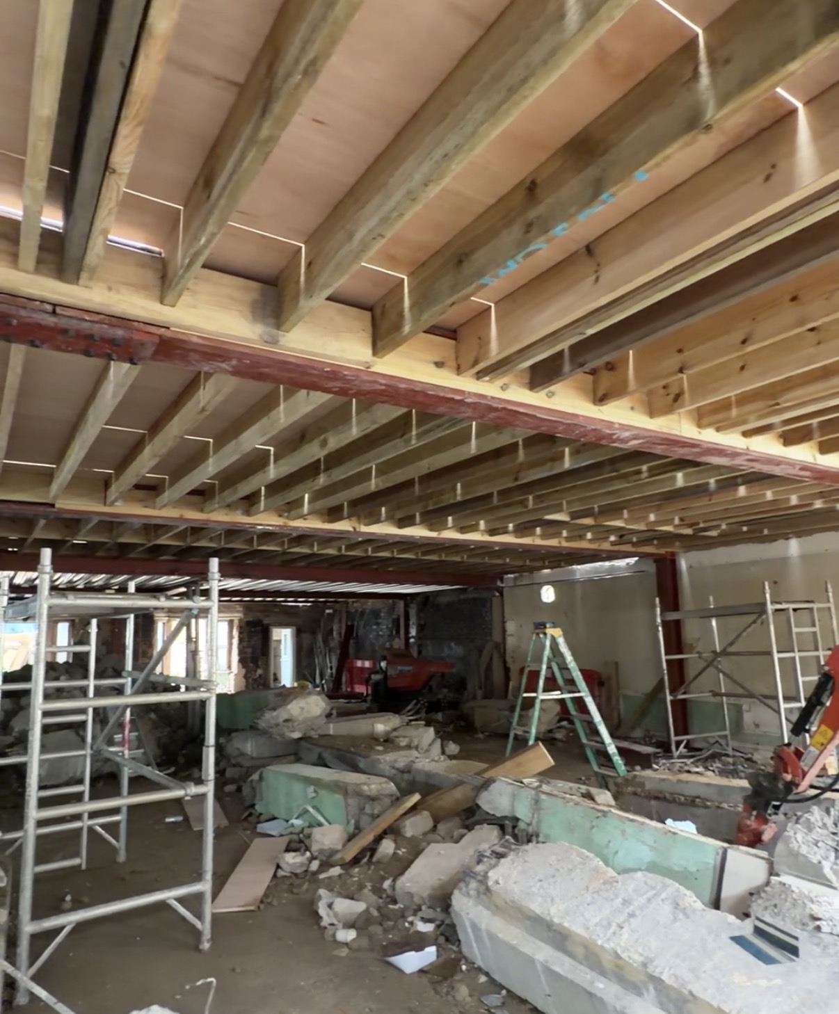 Groundworks and foundations — new floor joists set over concrete foundation bases, July 2026